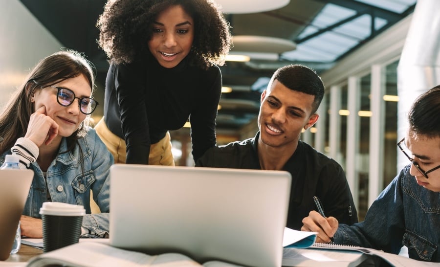 Group of people looking at laptop screen